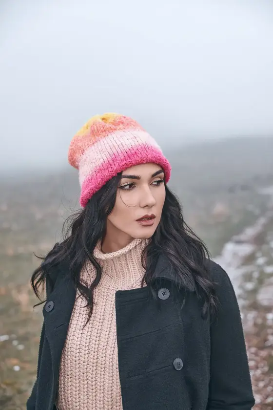 Model in a pink ombré beanie