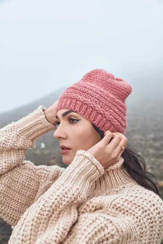Model wearing a pink chunky beanie